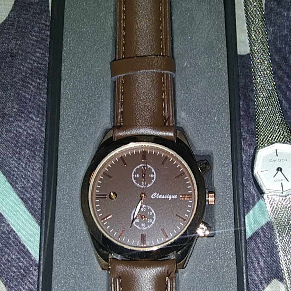 A mens Classique brown leather wrist watch